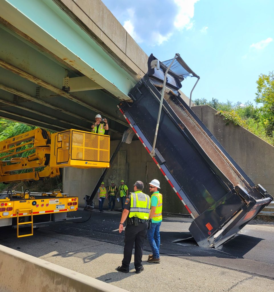 Dump truck strikes overpass on Route 40 in California - Herald-Standard